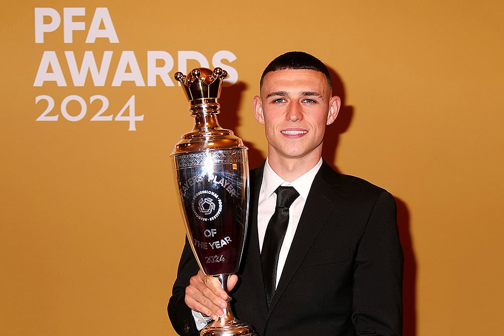 | Photo: Peter Byrne/PA via AP : Britain PFA Player Awards: Phil Foden poses with PFA Player of the Year award